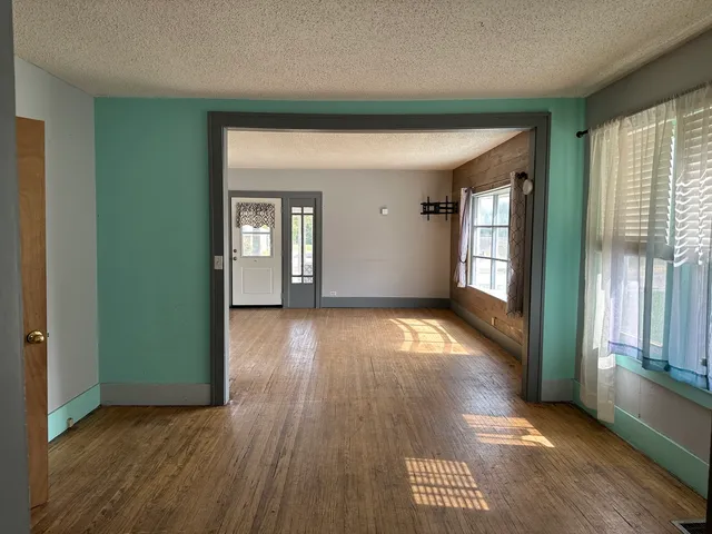 a view of empty room with windows