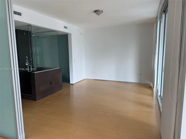 an empty room with closet area