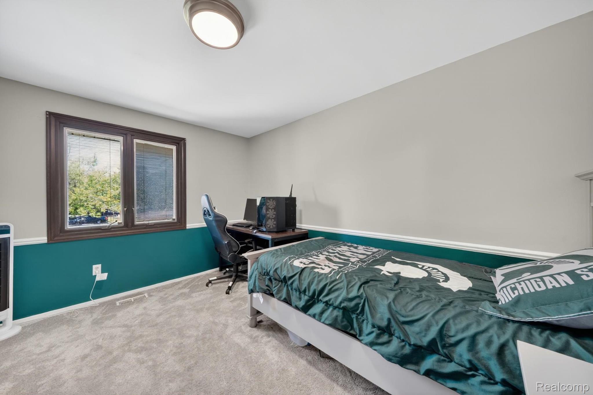 5469 Pheasant Run Road Clarkston, MI 48346 - Photo 18 of 36 Room featuring two-tone wall paint with a lower teal section and upper light gray, accented by white trim