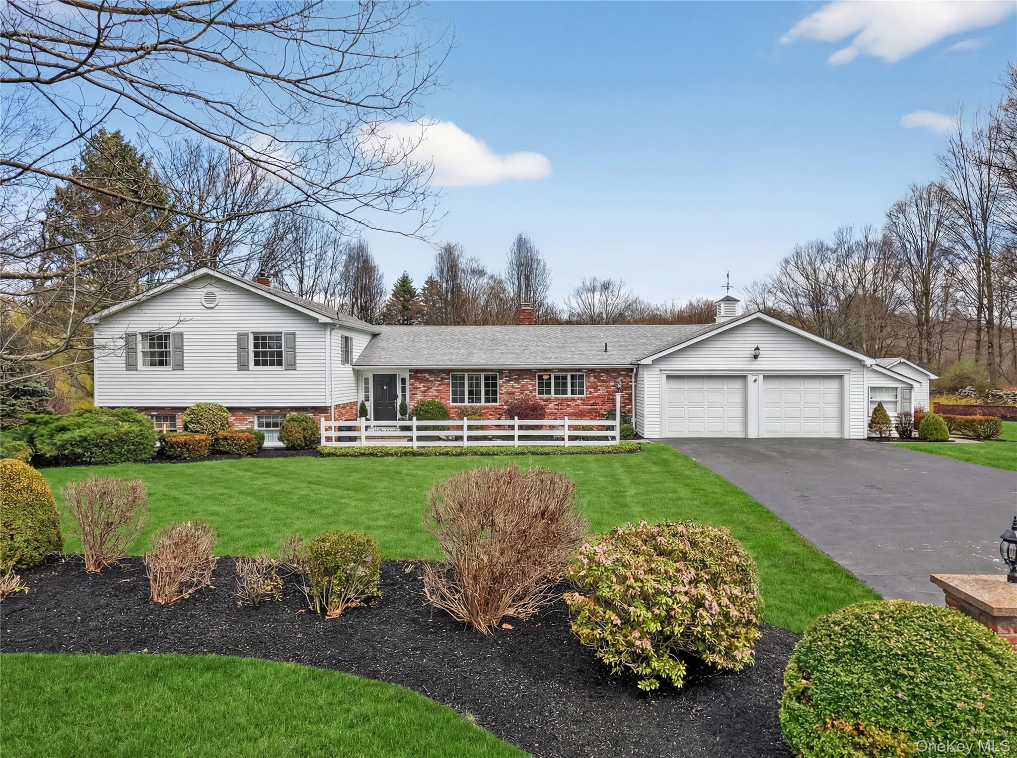 Home Sweet Home! Lovely curb appeal and professionally landscaped Split Level on 1.73 acres