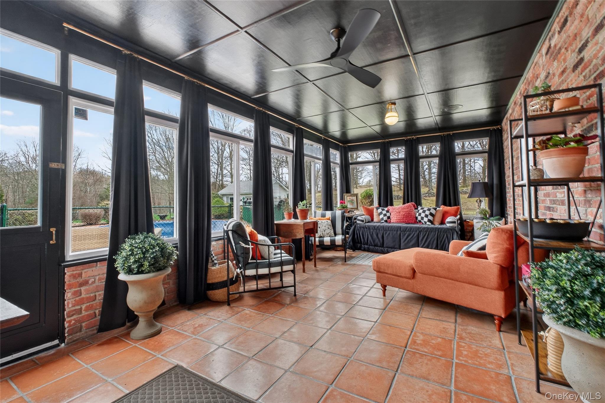 58 Dutchess Hill Road Poughkeepsie, NY 12601 - Photo 16 of 50 Enormous Sunroom with tiled floor and views to the private backyard