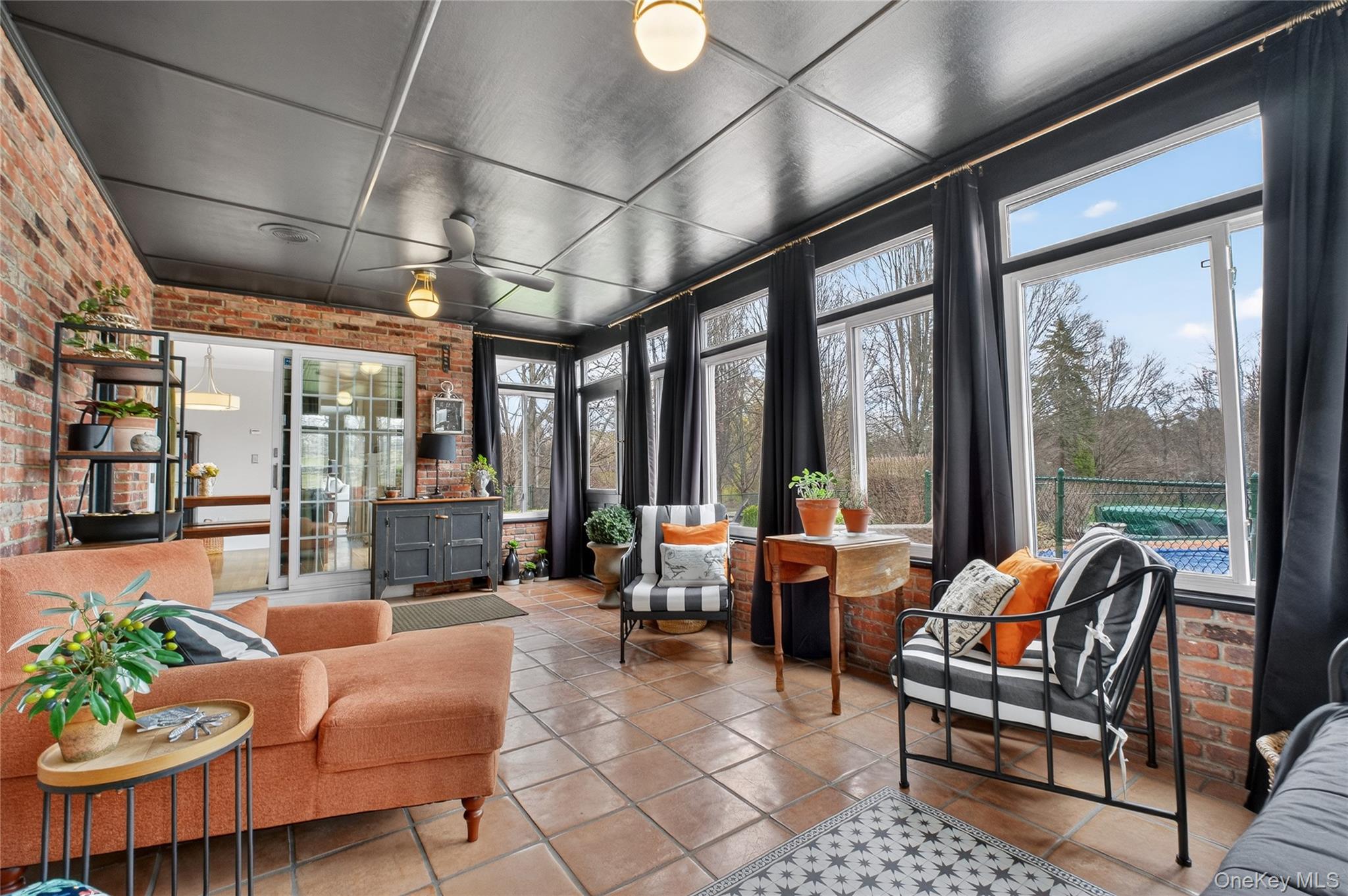 58 Dutchess Hill Road Poughkeepsie, NY 12601 - Photo 17 of 50 Enormous Sunroom with tiled floor and views to the private backyard