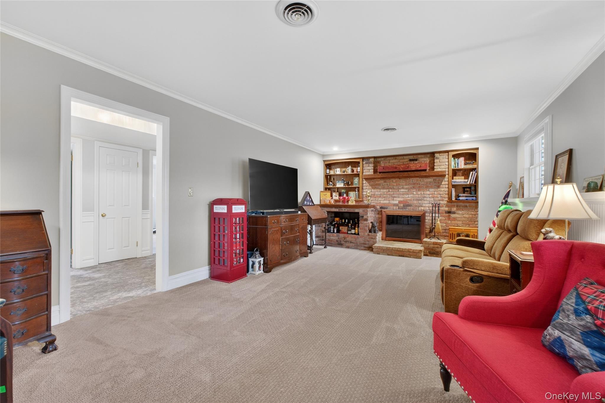 58 Dutchess Hill Road Poughkeepsie, NY 12601 - Photo 28 of 50 Family room with brick fireplace and built ins