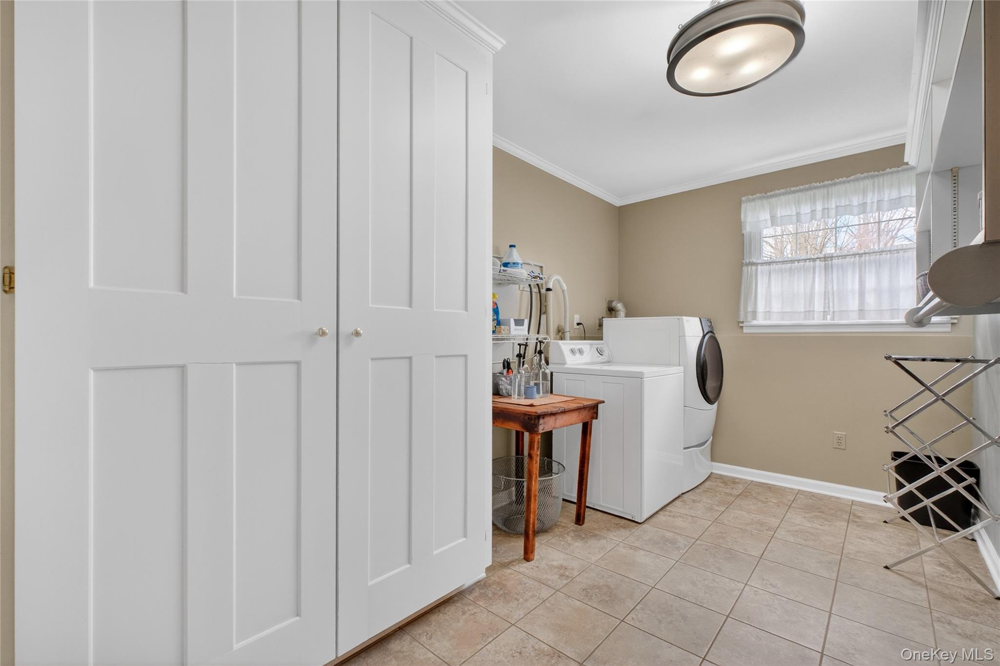 58 Dutchess Hill Road Poughkeepsie, NY 12601 - Photo 30 of 50 Spacious laundry room with large closet, shelving and tiled floor