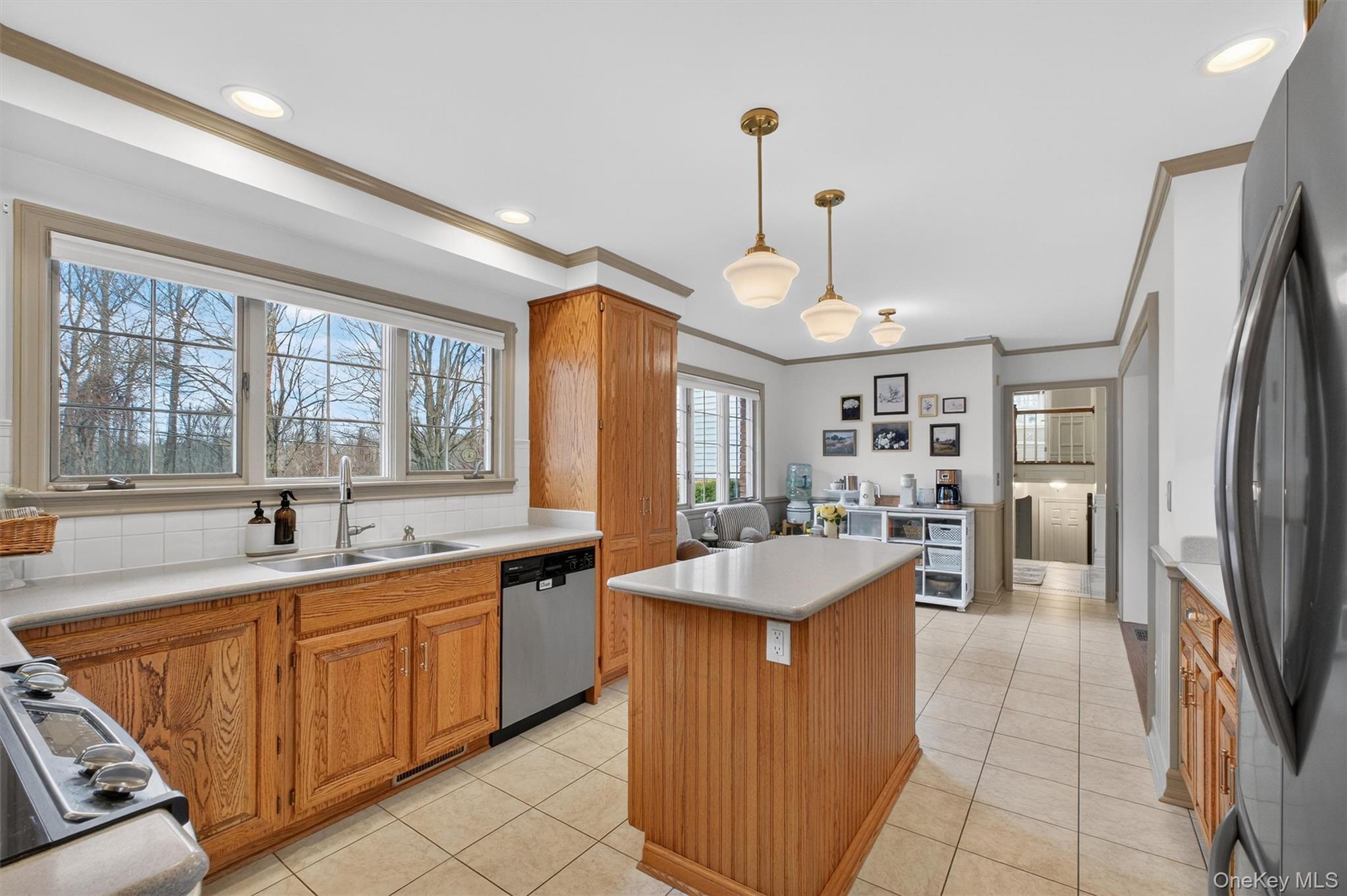 58 Dutchess Hill Road Poughkeepsie, NY 12601 - Photo 10 of 50 Open, bright kitchen with loads of cabinets, center island, corian counters and SS appliances