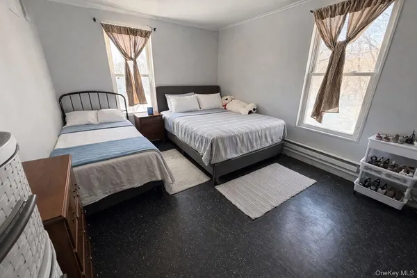 a bedroom with bed and window