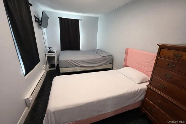 a bedroom with a bed and walk in closet