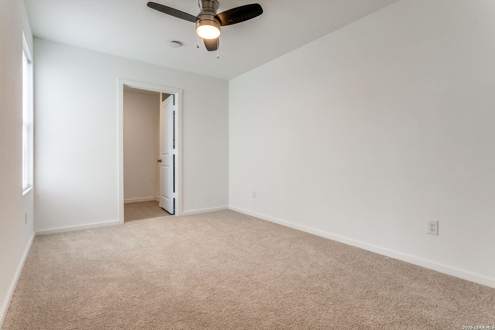 5010 Primrose Converse, TX 78109 - Photo 11 of 24 an empty room with a ceiling fan