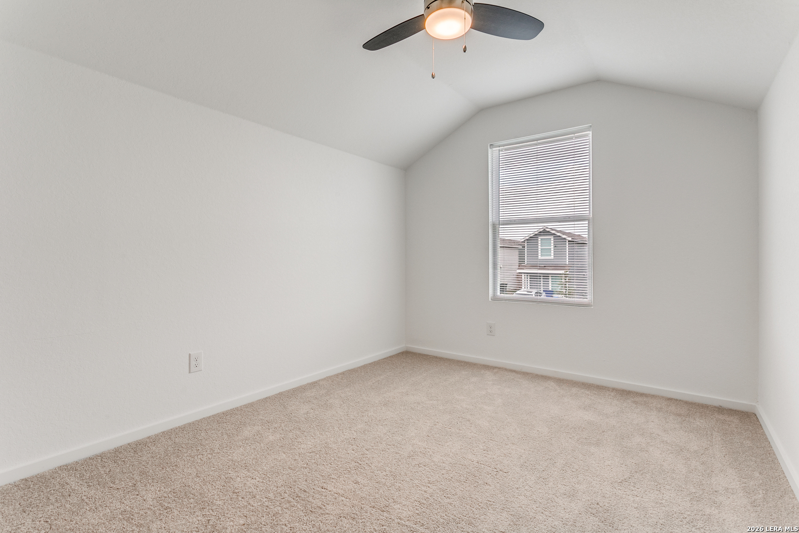 5010 Primrose Converse, TX 78109 - Photo 19 of 24 an empty room with a chandelier fan and windows