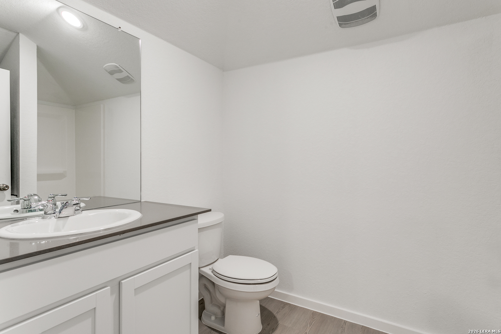 5010 Primrose Converse, TX 78109 - Photo 20 of 24 a bathroom with a granite countertop toilet and a sink