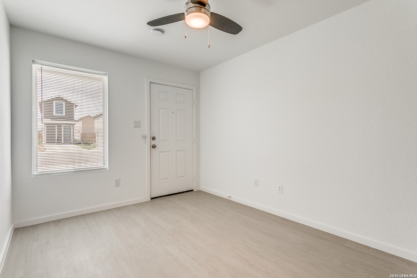5010 Primrose Converse, TX 78109 - Photo 4 of 24 an empty room with windows and fan