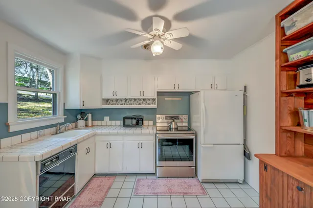 a view of a livingroom with shelves