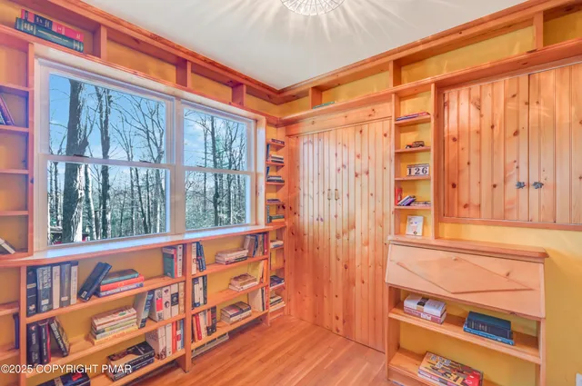a bathroom with a sink a mirror and a window