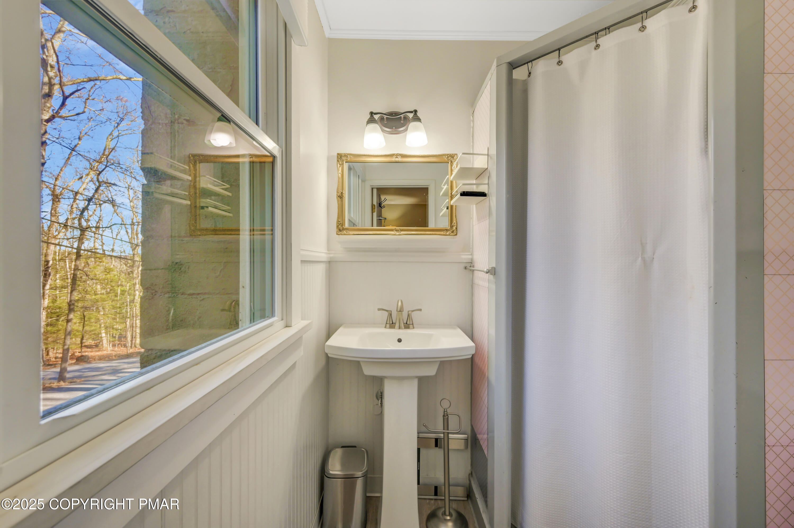 2148 Laurel Lane Cresco, PA 18326 - Photo 20 of 58 a bathroom with a sink a mirror and a window
