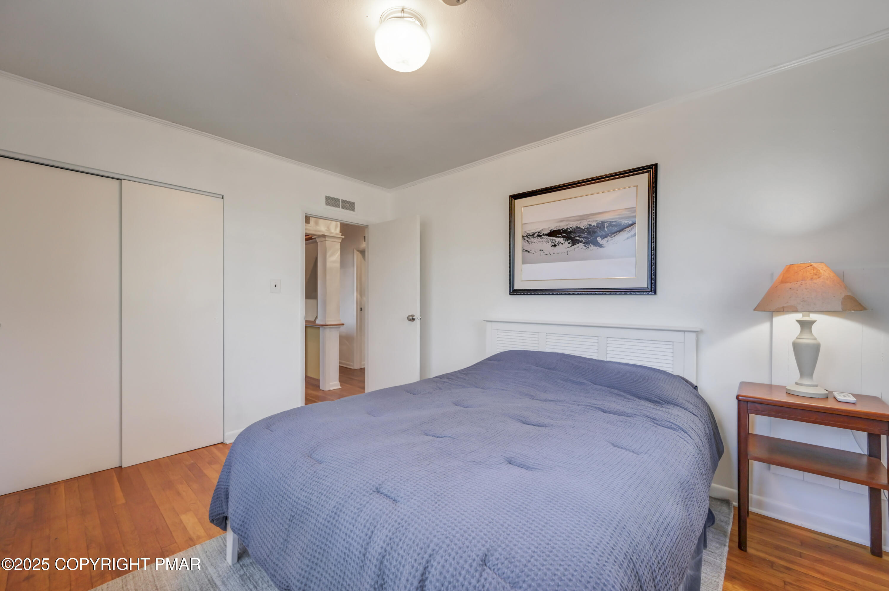 2148 Laurel Lane Cresco, PA 18326 - Photo 22 of 58 a bedroom with a bed and a painting on the wall