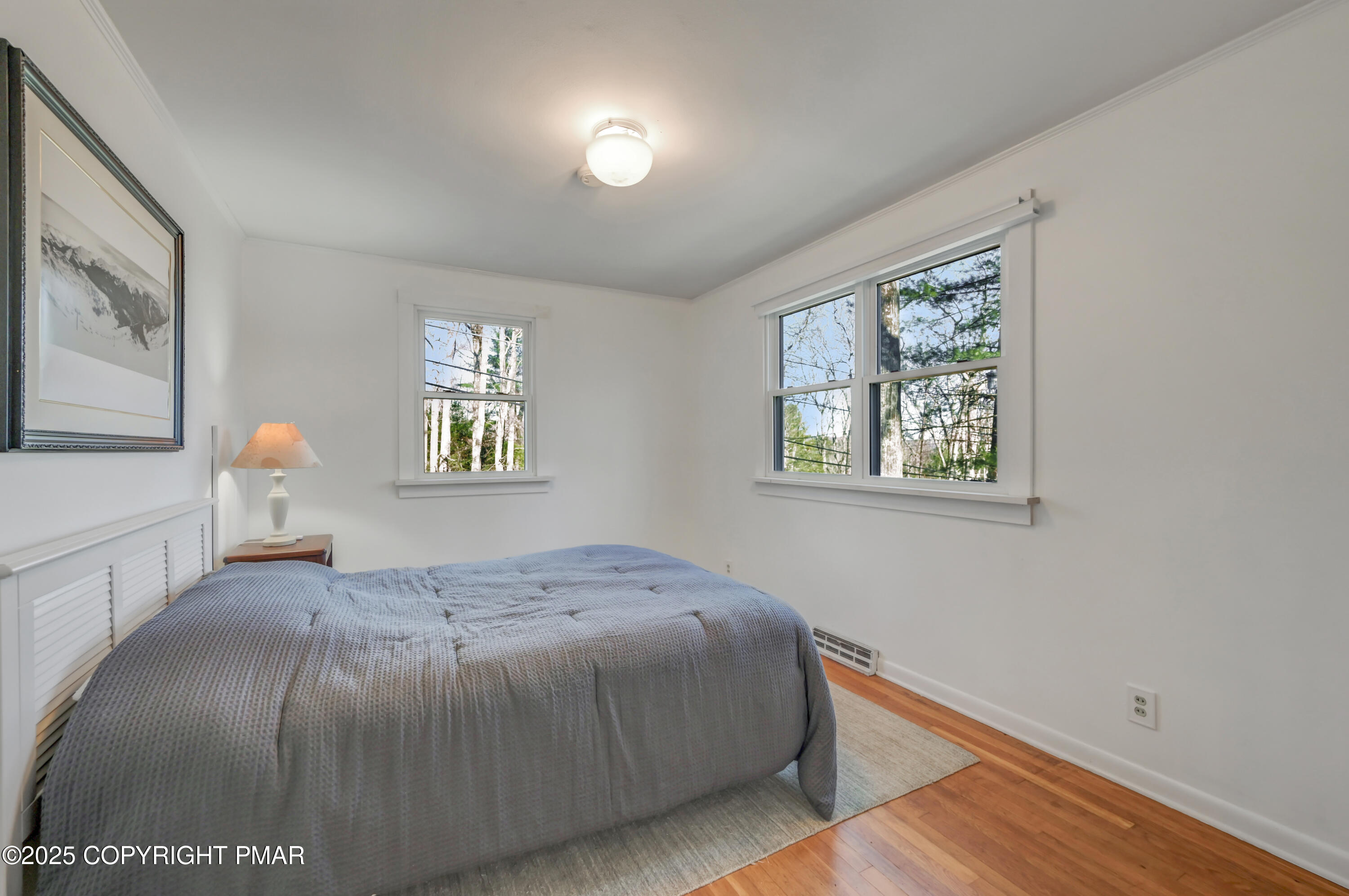 2148 Laurel Lane Cresco, PA 18326 - Photo 23 of 58 a bed sitting in a bedroom next to a window