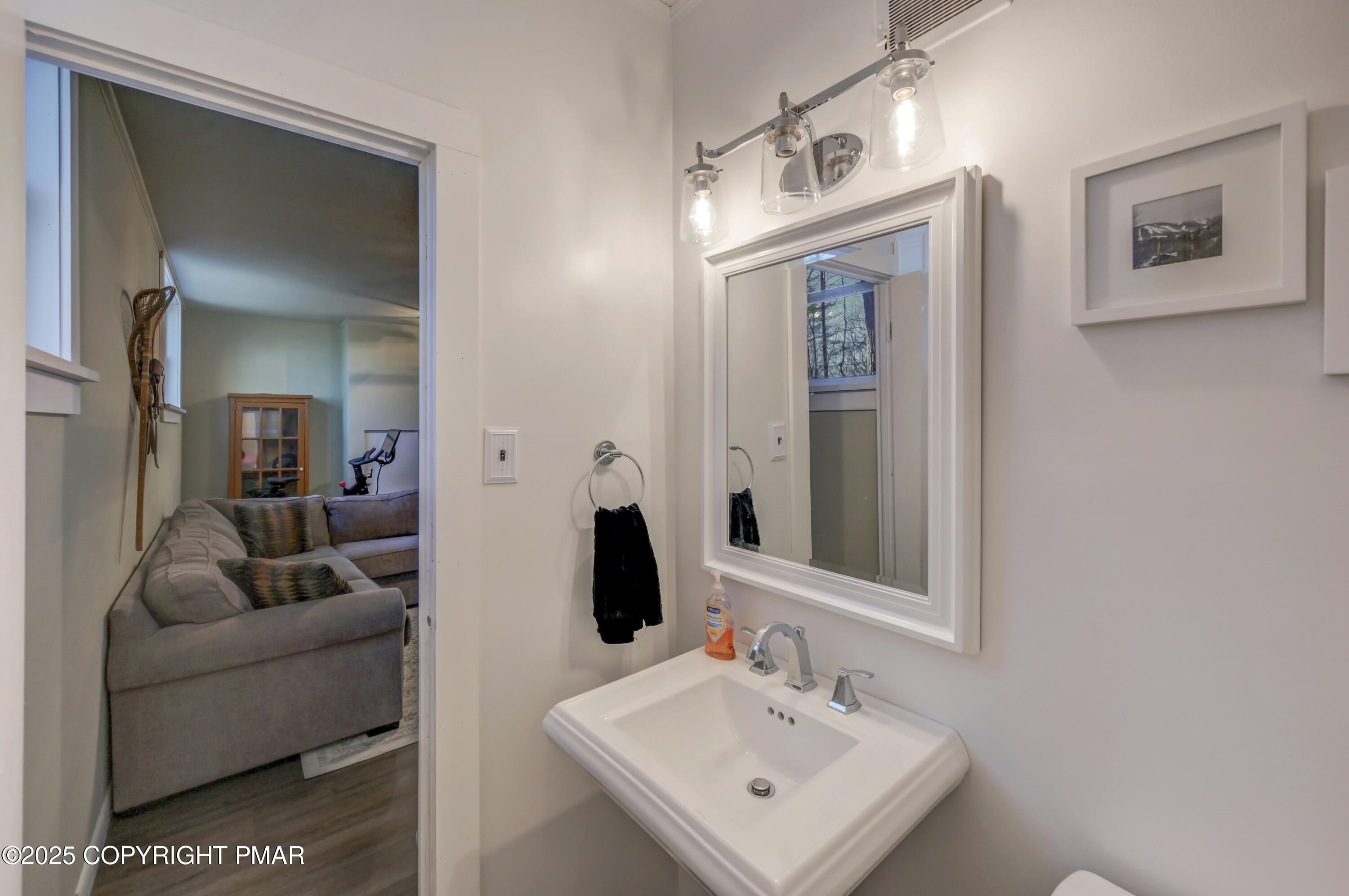 2148 Laurel Lane Cresco, PA 18326 - Photo 30 of 58 a en suite bathroom with a toilet sink and mirror