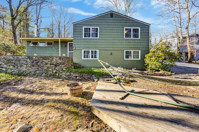 a view of a green field with lots of bushes