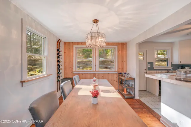a view of a dining room with furniture window and outside view