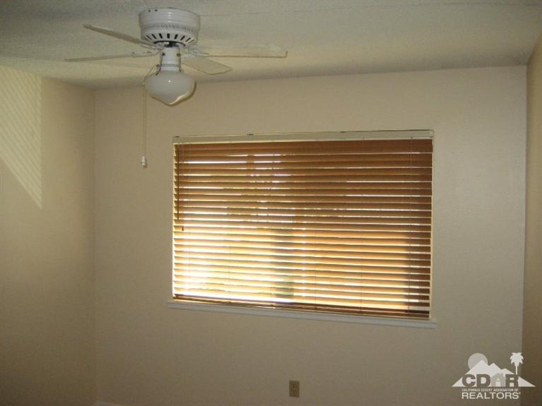 72711 Eagle Road, Unit 4 Palm Desert, CA 92260 - Photo 12 of 29 a view of a room that has a window in it