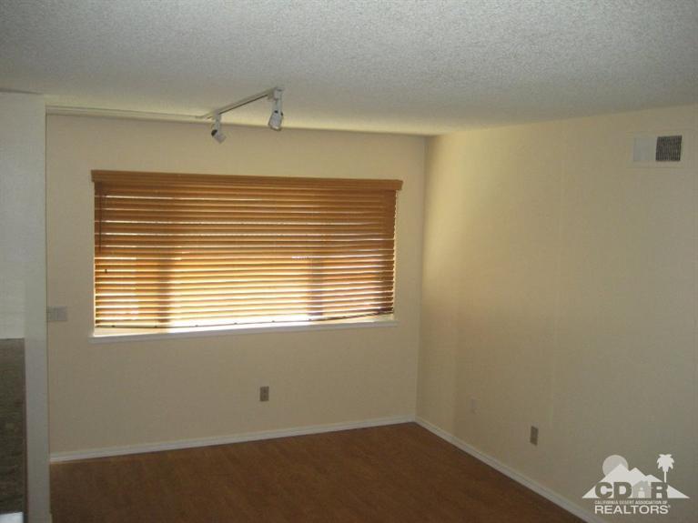 72711 Eagle Road, Unit 4 Palm Desert, CA 92260 - Photo 15 of 29 a view of a room that has a window in it