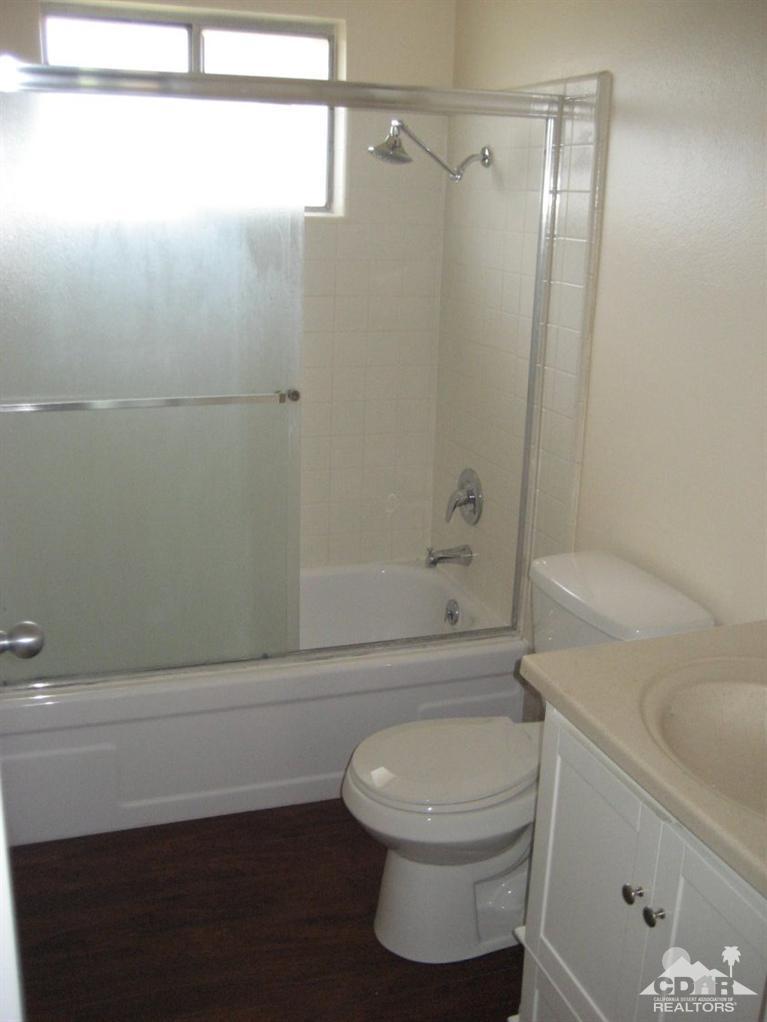 72711 Eagle Road, Unit 4 Palm Desert, CA 92260 - Photo 9 of 29 a bathroom with a toilet and a shower