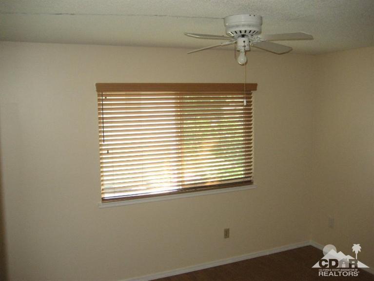 72711 Eagle Road, Unit 4 Palm Desert, CA 92260 - Photo 10 of 29 a view of a window in an empty room