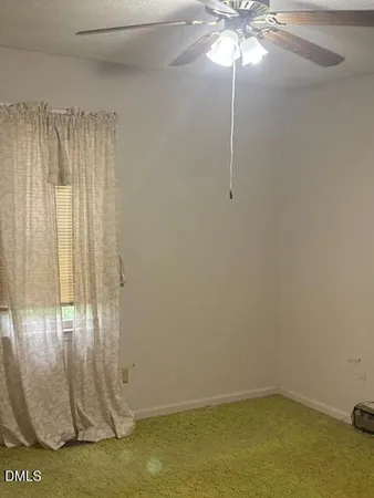 a view of a chandelier fan in a room
