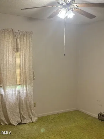 a view of a chandelier fan in a room