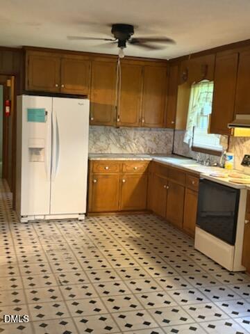 10329 Fanny Brown Road Raleigh, NC 27603 - Photo 9 of 11 a kitchen with a sink a stove and a refrigerator