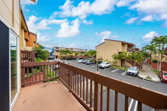 a view of a street from a balcony
