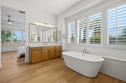 a large spacious bathroom with a large tub and sink