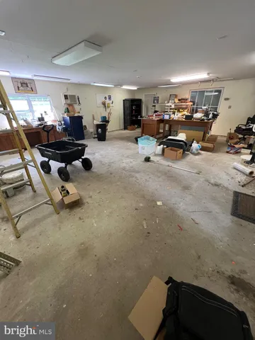a living room with furniture gym equipment and a view of living room