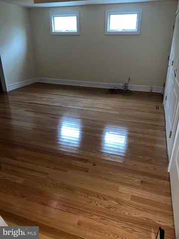 an entryway with wooden floor