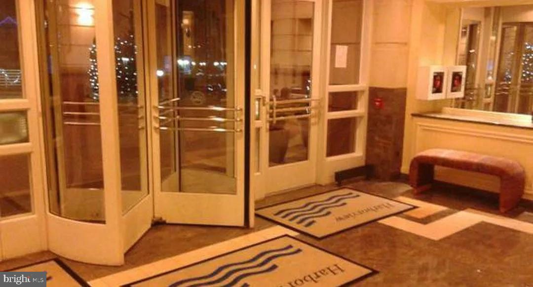 100 Harborview Drive, Unit 906 Baltimore, MD 21230 - Photo 15 of 16 a bathroom with a glass door shower and a sink