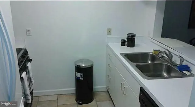 a close view of a sink and washer and dryer