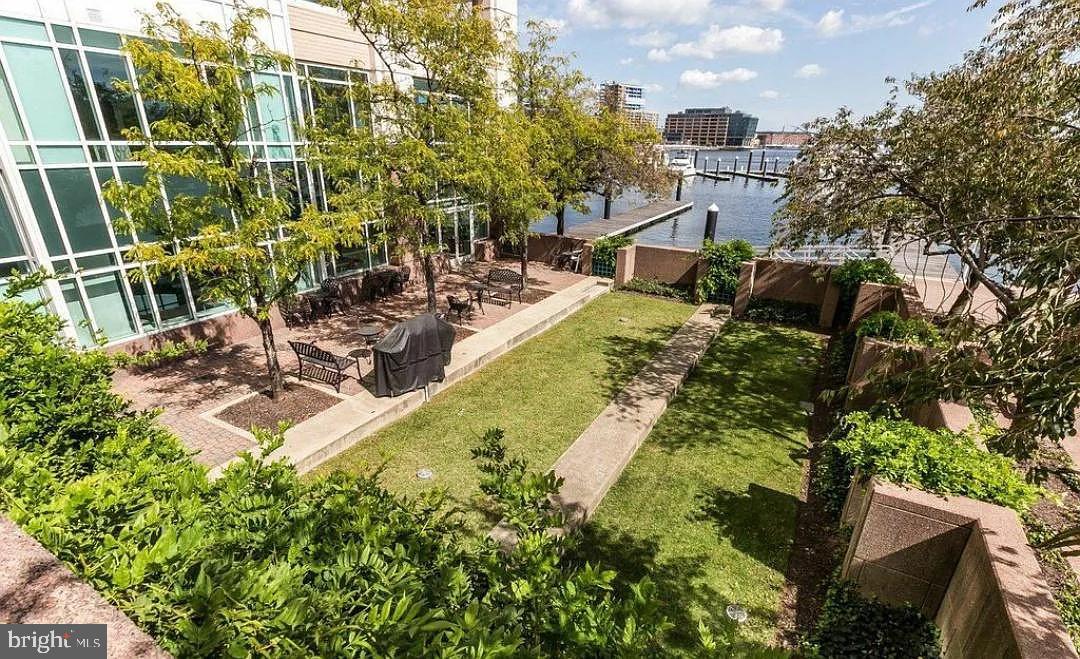 100 Harborview Drive, Unit 906 Baltimore, MD 21230 - Photo 9 of 16 a view of a swimming pool with a patio