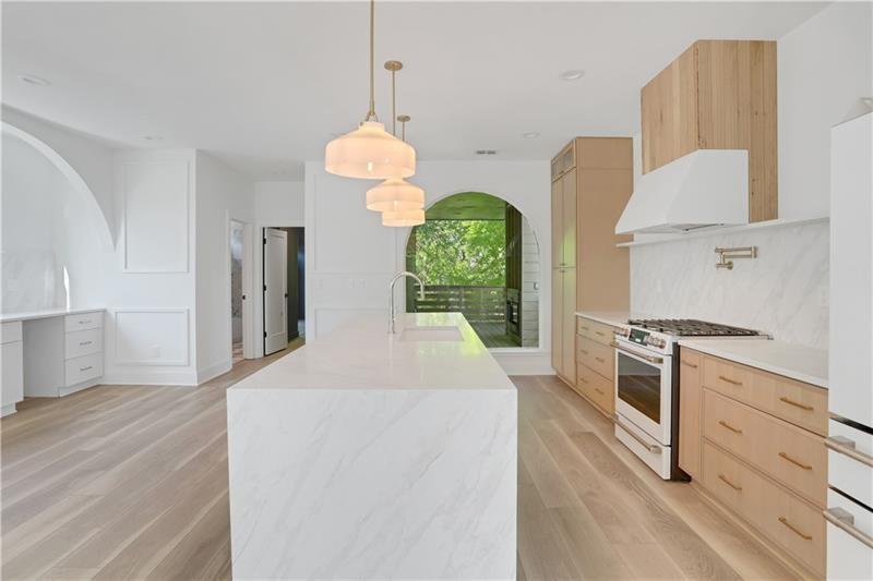 a kitchen with cabinets and appliances