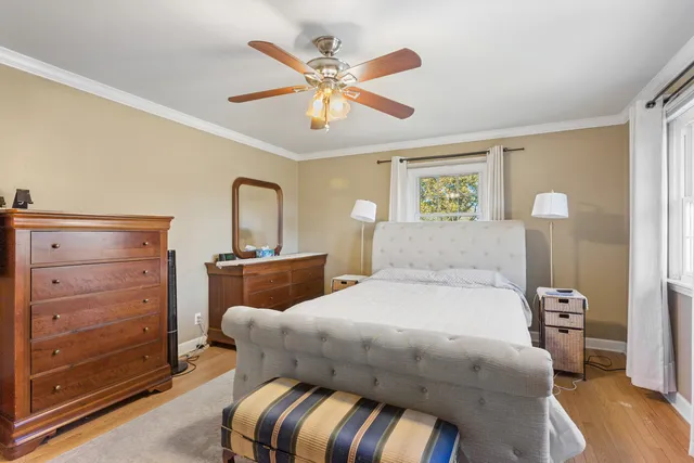 a bedroom with a bed and window