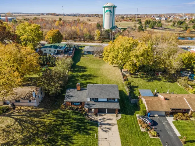 an aerial view of residential houses with outdoor space