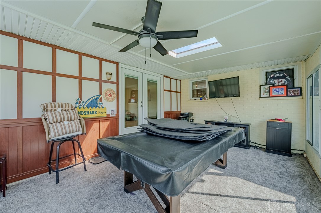 305 South Vandemark Road Sidney, OH 45365 - Photo 32 of 32 This versatile sunroom features a skylight and a ceiling fan, perfect for any activity.