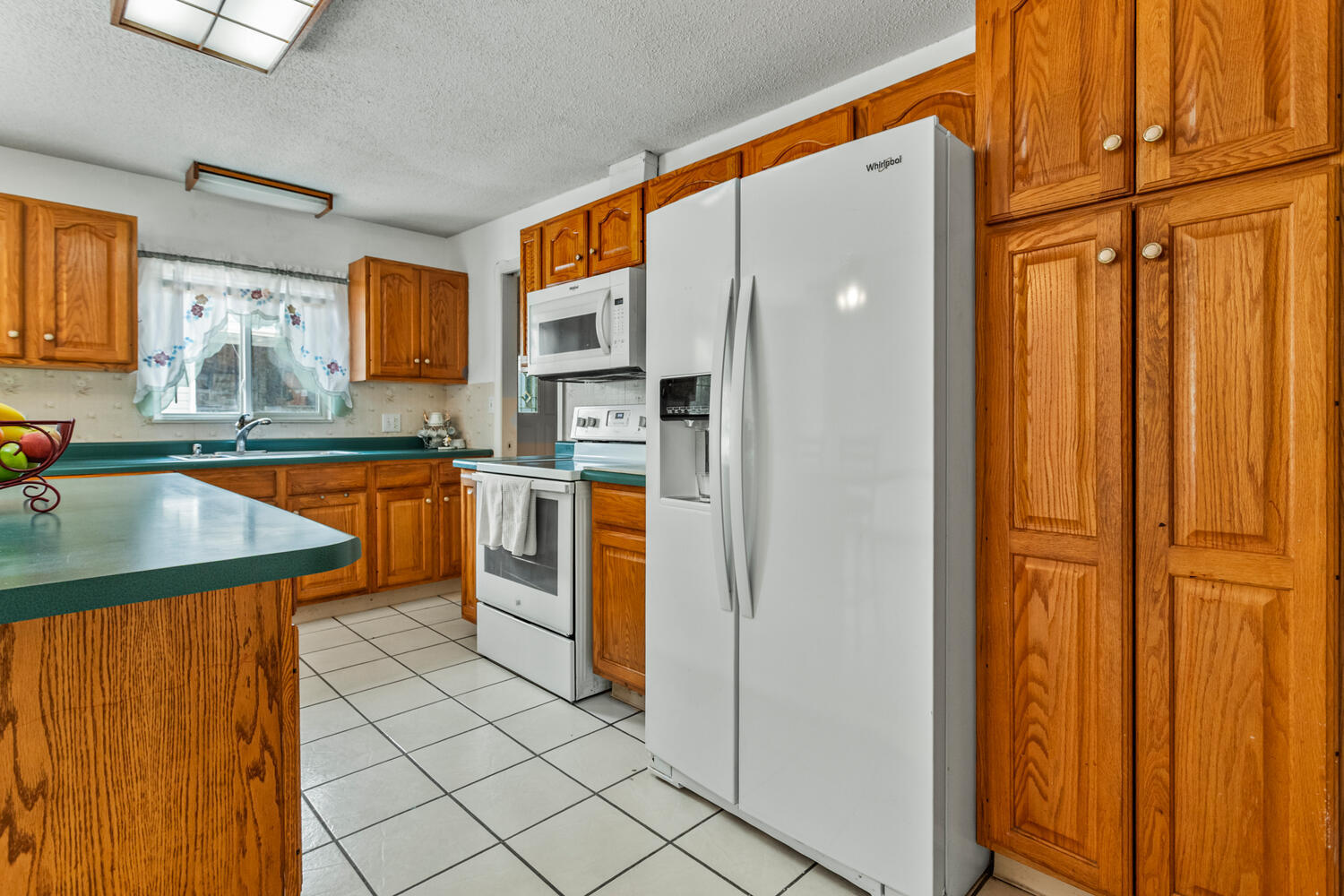 2503 Maplewood Drive Champaign, IL 61821 - Photo 11 of 37 a kitchen with stainless steel appliances granite countertop a refrigerator and a sink