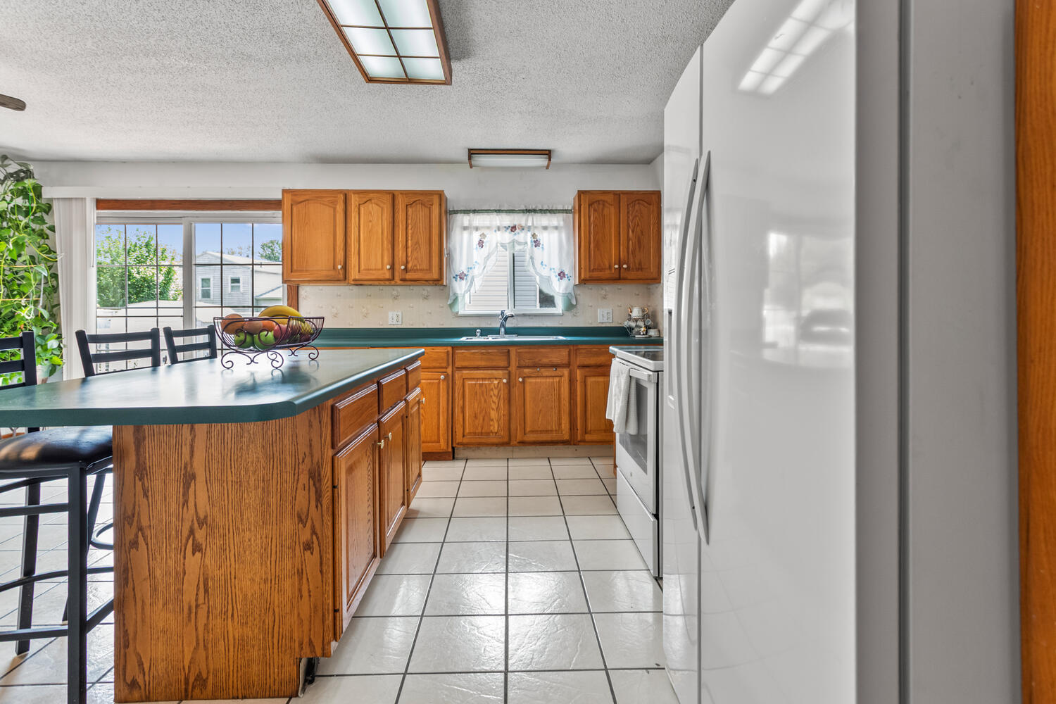 2503 Maplewood Drive Champaign, IL 61821 - Photo 15 of 37 a kitchen with stainless steel appliances granite countertop a sink and cabinets