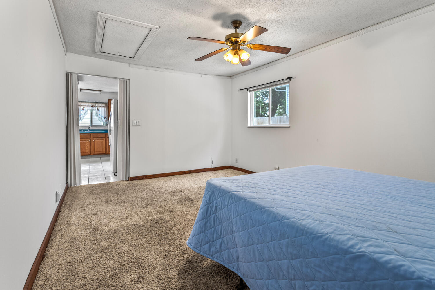 2503 Maplewood Drive Champaign, IL 61821 - Photo 17 of 37 a bedroom with a bed and a chandelier