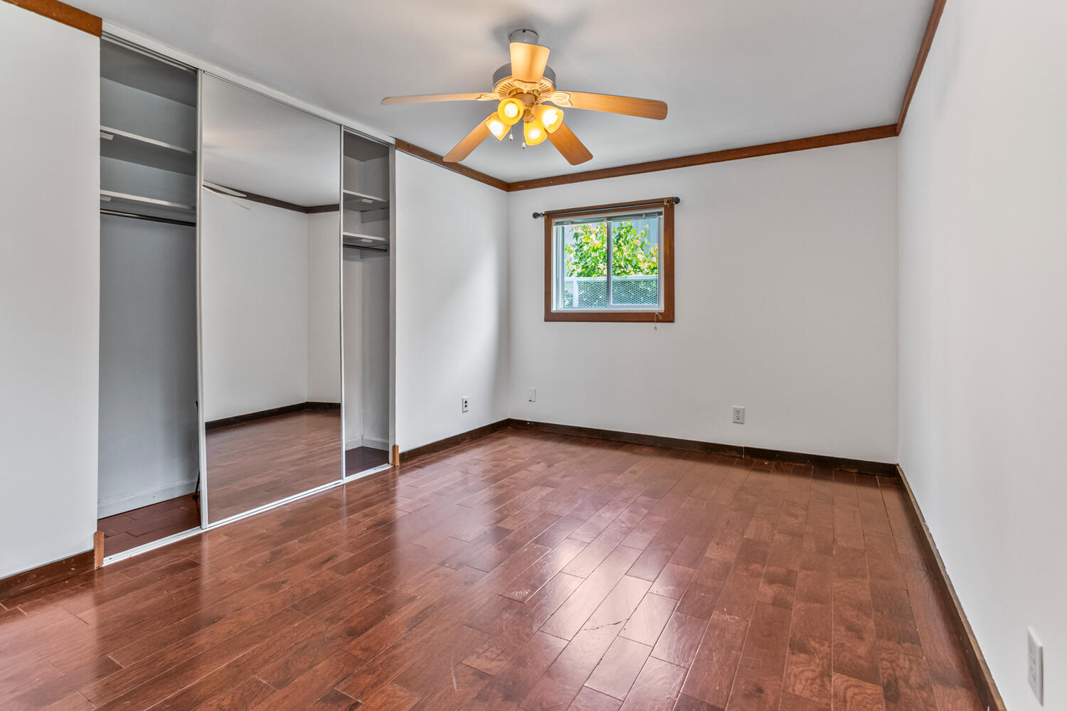 2503 Maplewood Drive Champaign, IL 61821 - Photo 20 of 37 an empty room with wooden floor and windows