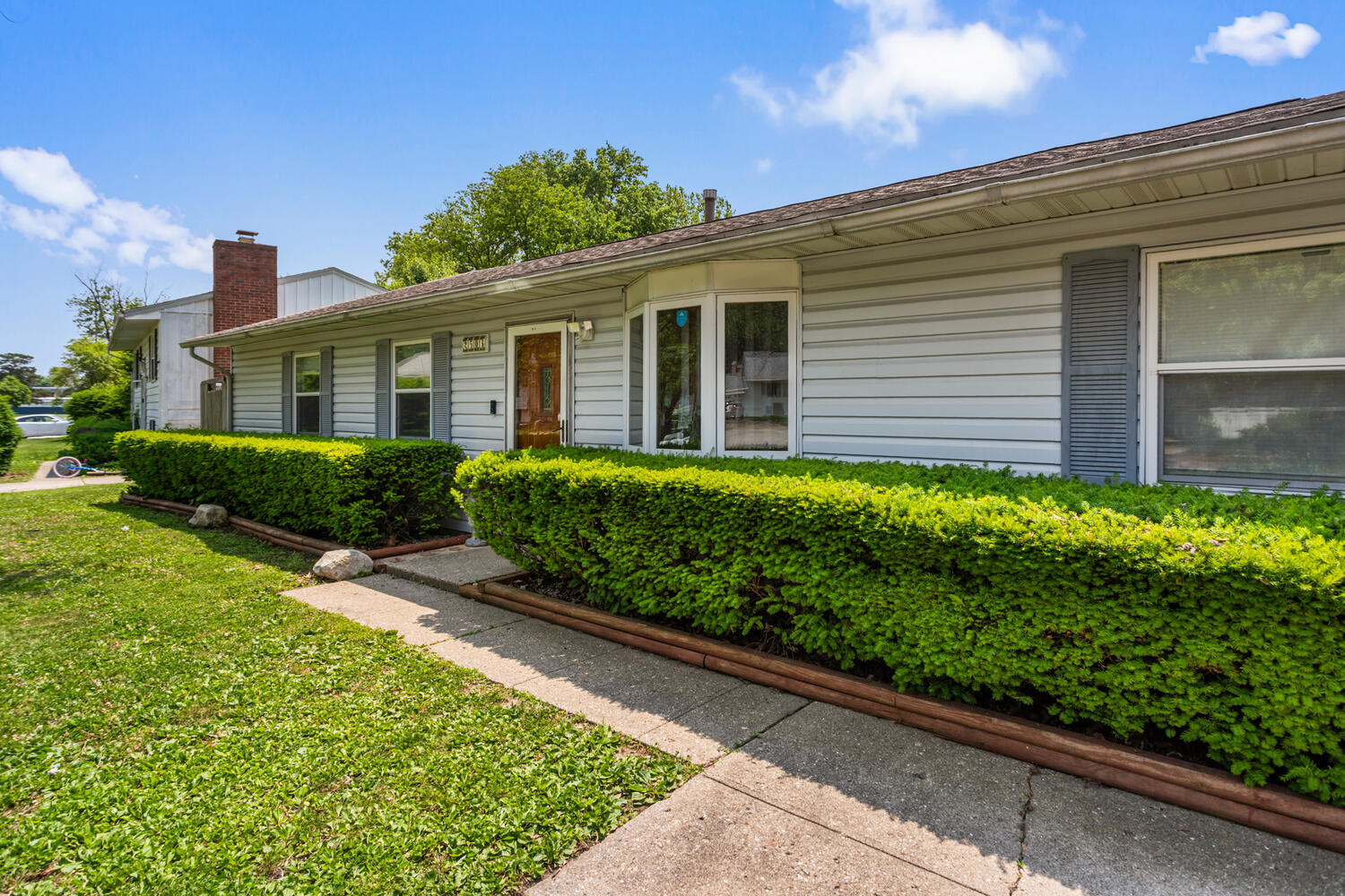 2503 Maplewood Drive Champaign, IL 61821 - Photo 2 of 37 a front view of house with garden and trees