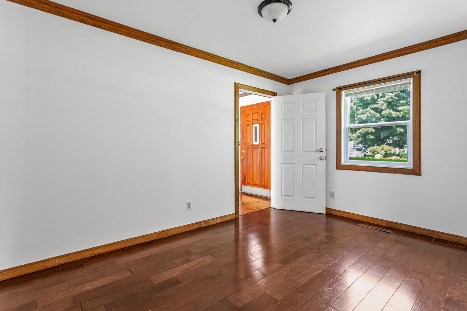 2503 Maplewood Drive Champaign, IL 61821 - Photo 25 of 37 an empty room with wooden floor and windows