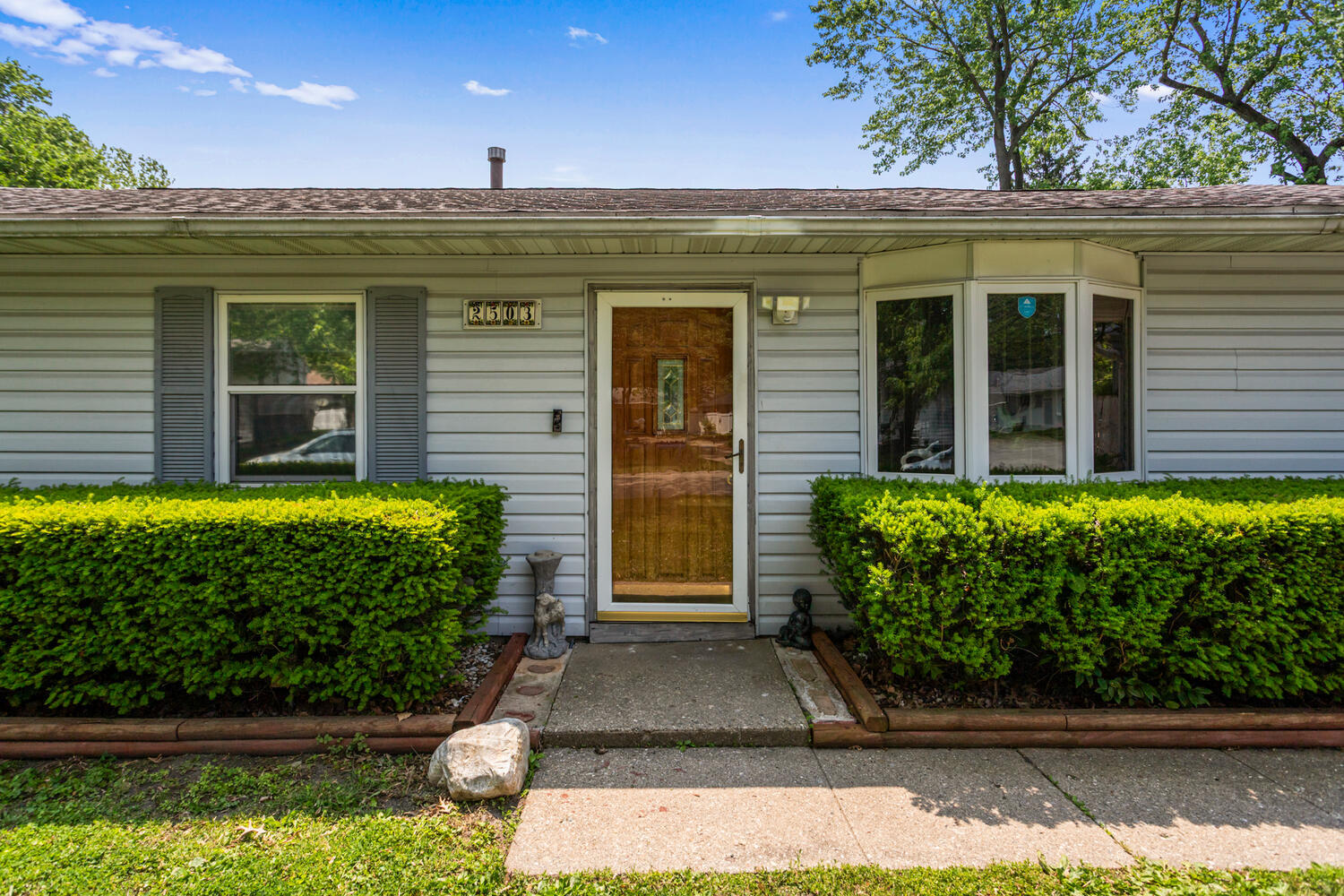 2503 Maplewood Drive Champaign, IL 61821 - Photo 3 of 37 a front view of a house with garden