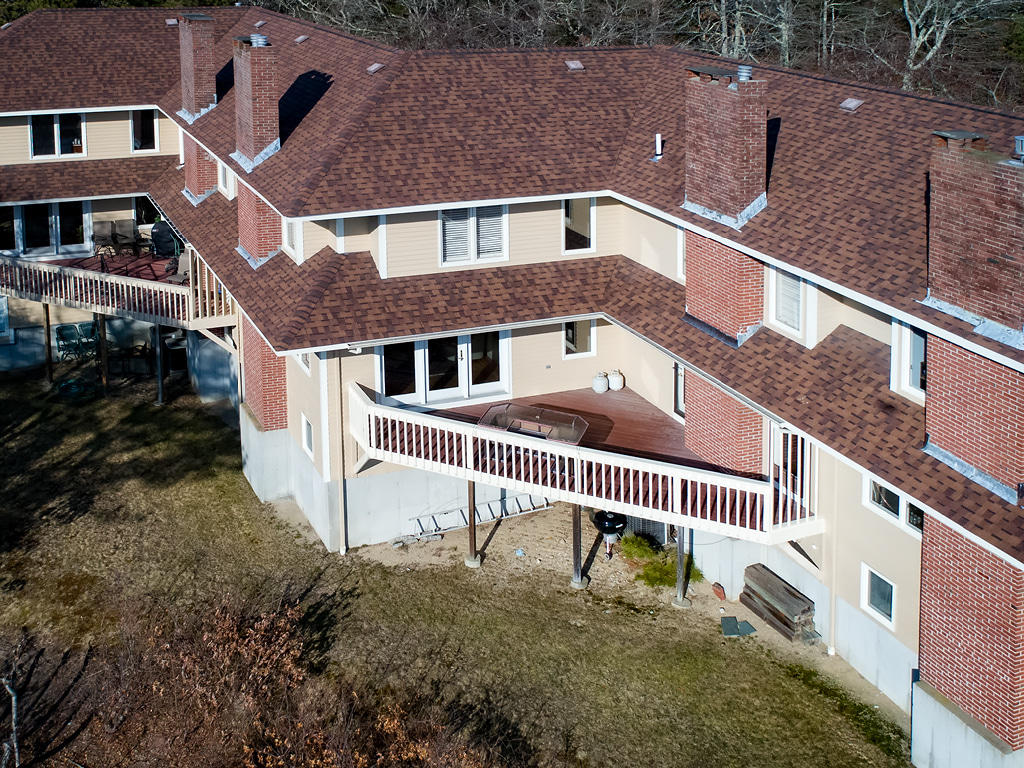 2 Dogwood Road, Unit H Buzzards Bay, MA 02532 - Photo 12 of 41 a front view of a house with a yard