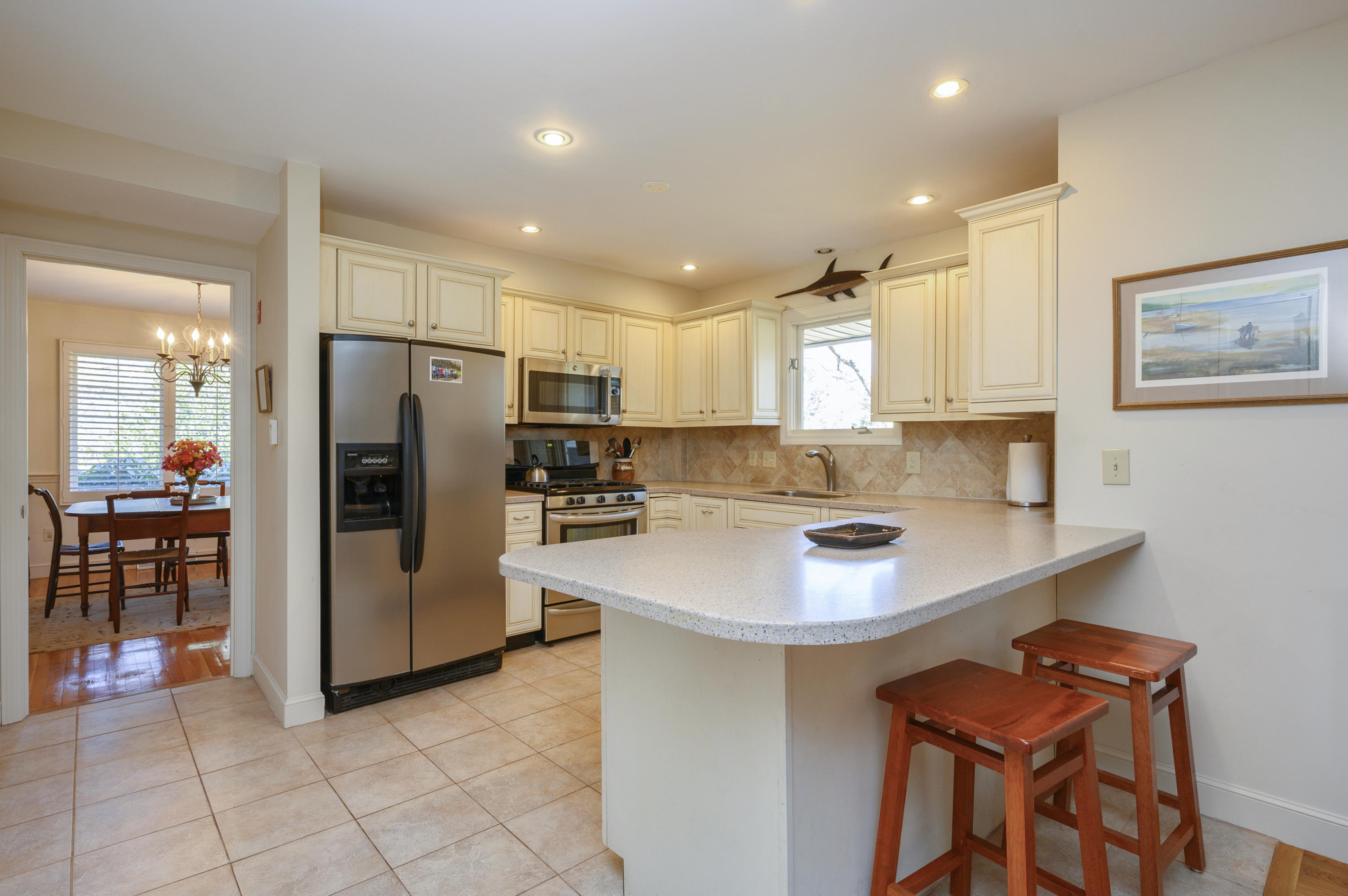 2 Dogwood Road, Unit H Buzzards Bay, MA 02532 - Photo 15 of 41 a kitchen with stainless steel appliances a sink and a refrigerator